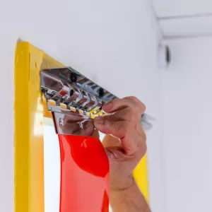 support de fixation pour lanières PVC de portes à lames